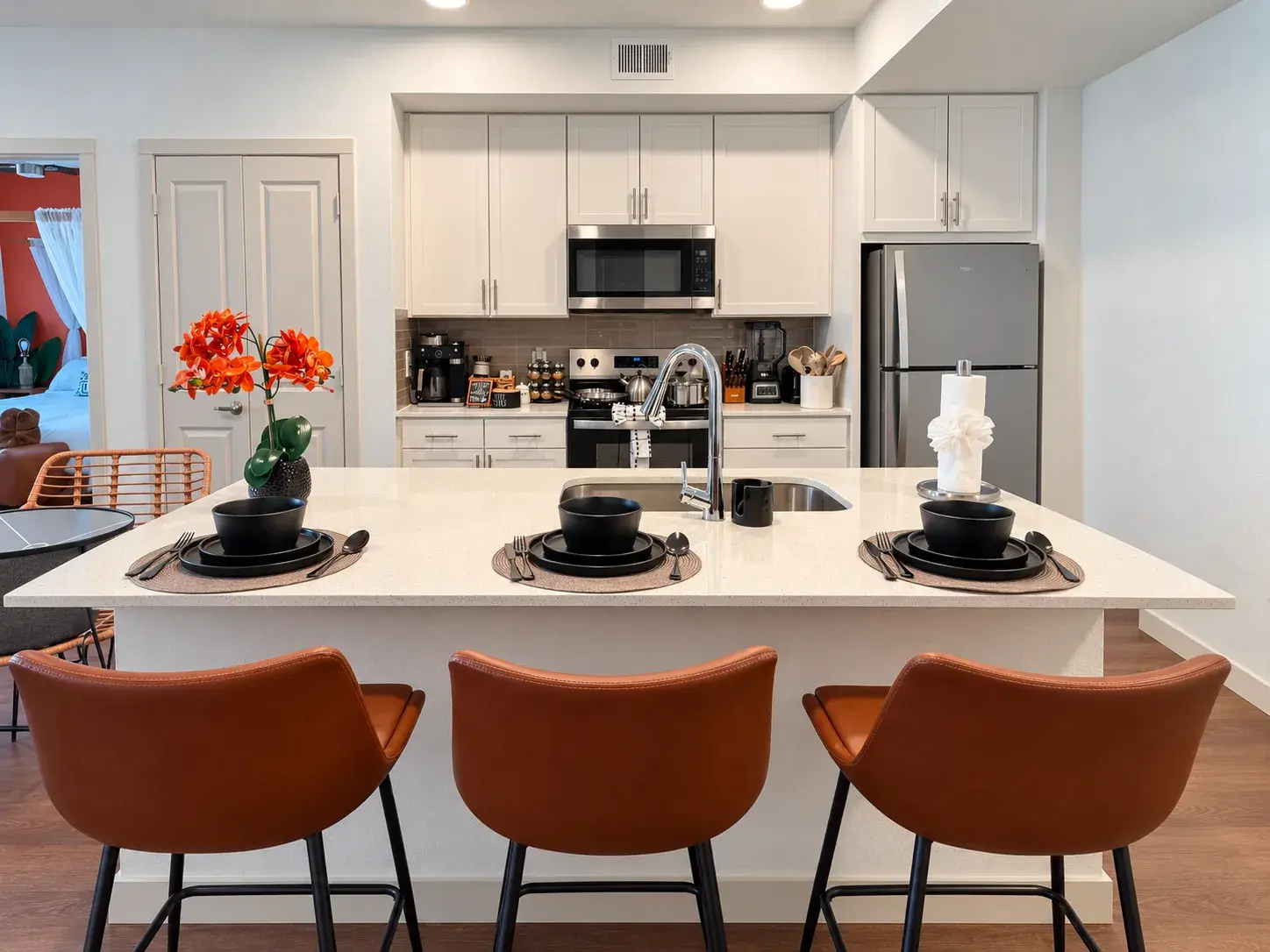 Kitchen with island seating for three
