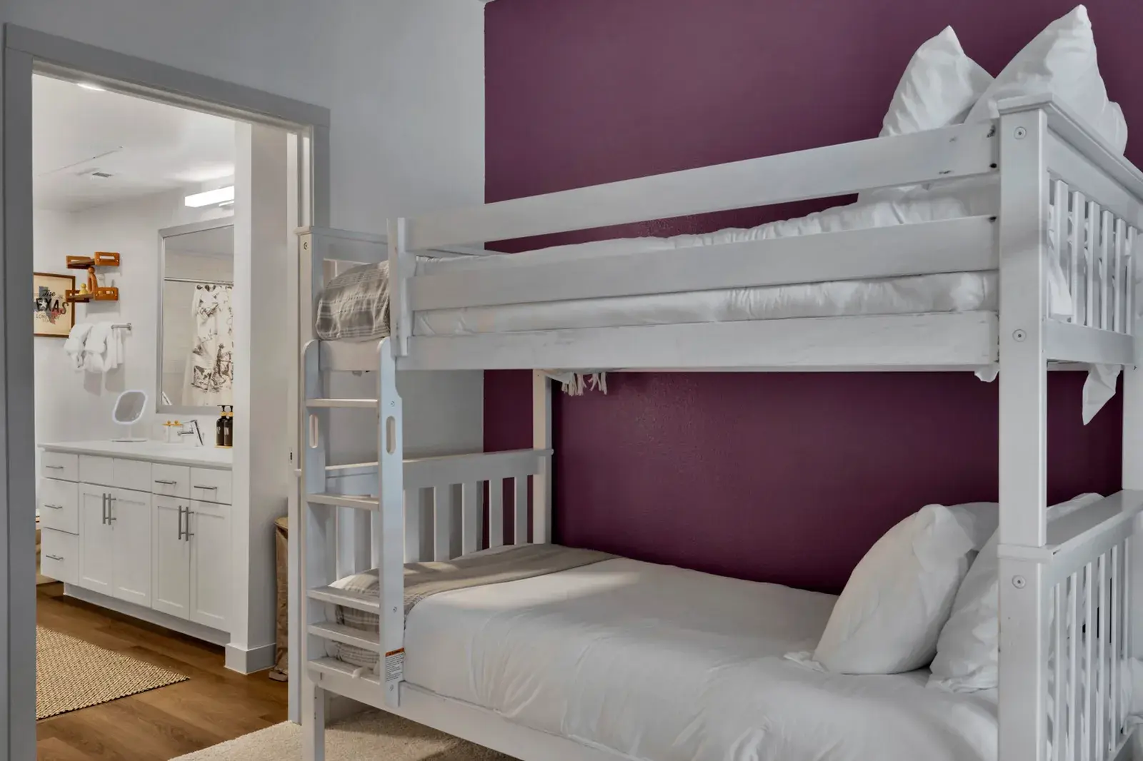 Bunk room with an accent wall