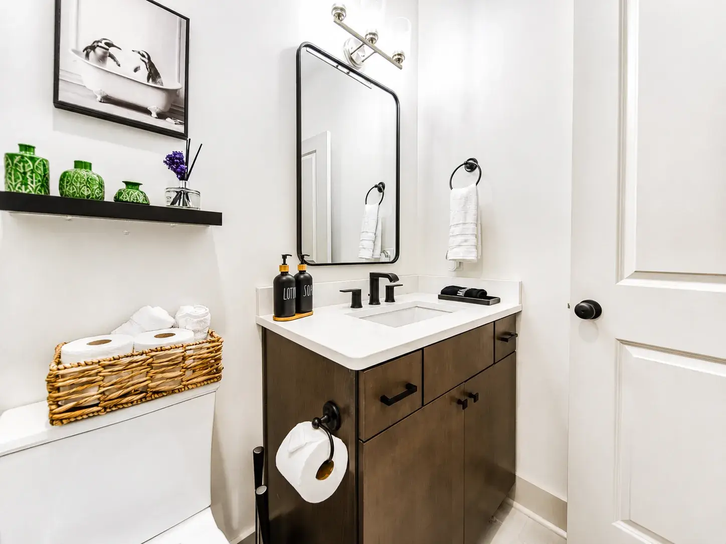 Modern bathroom with stylish vanity, sleek finishes, and guest-ready touches