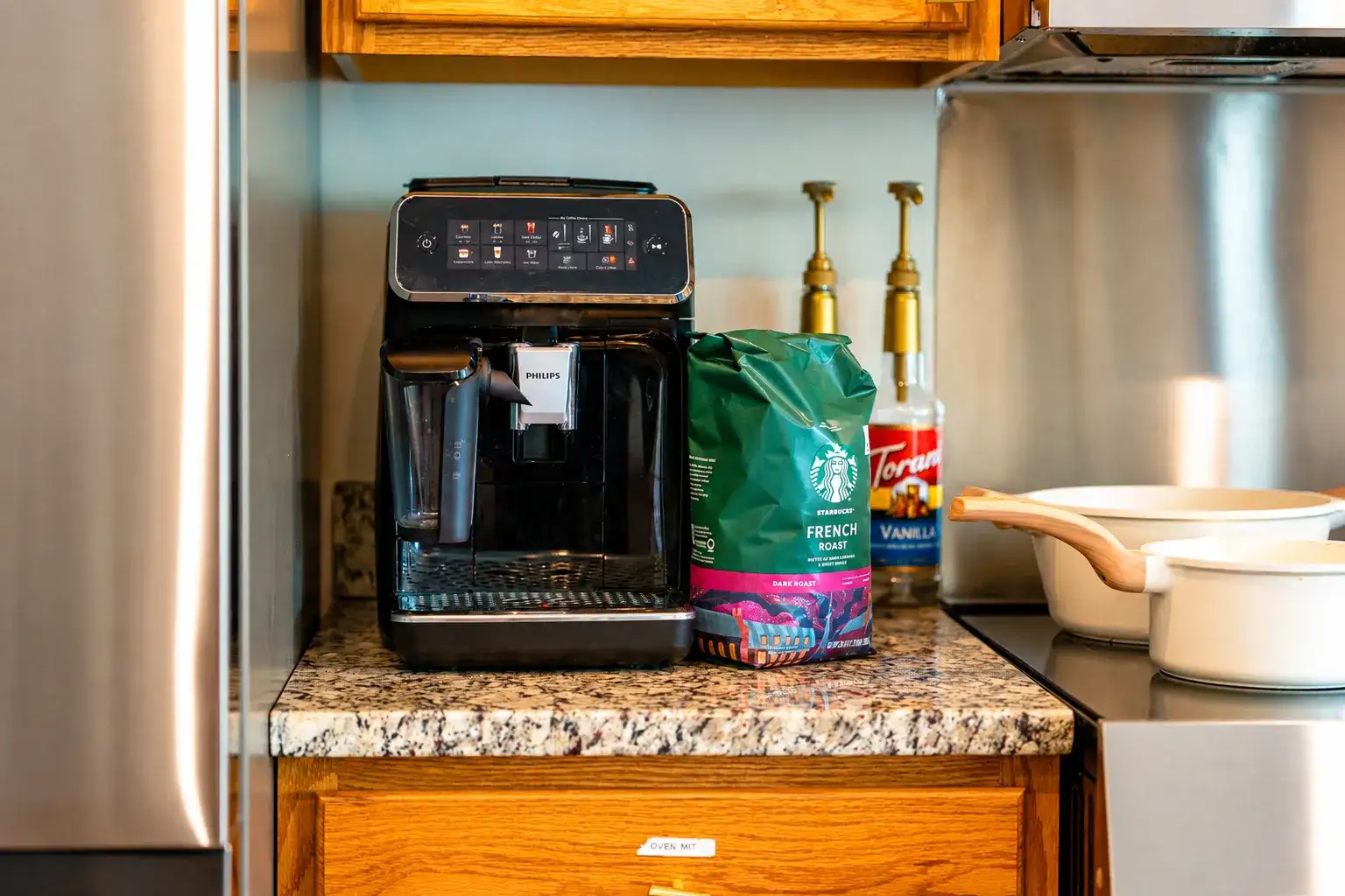 Modern kitchen coffee station with espresso maker and premium coffee setup