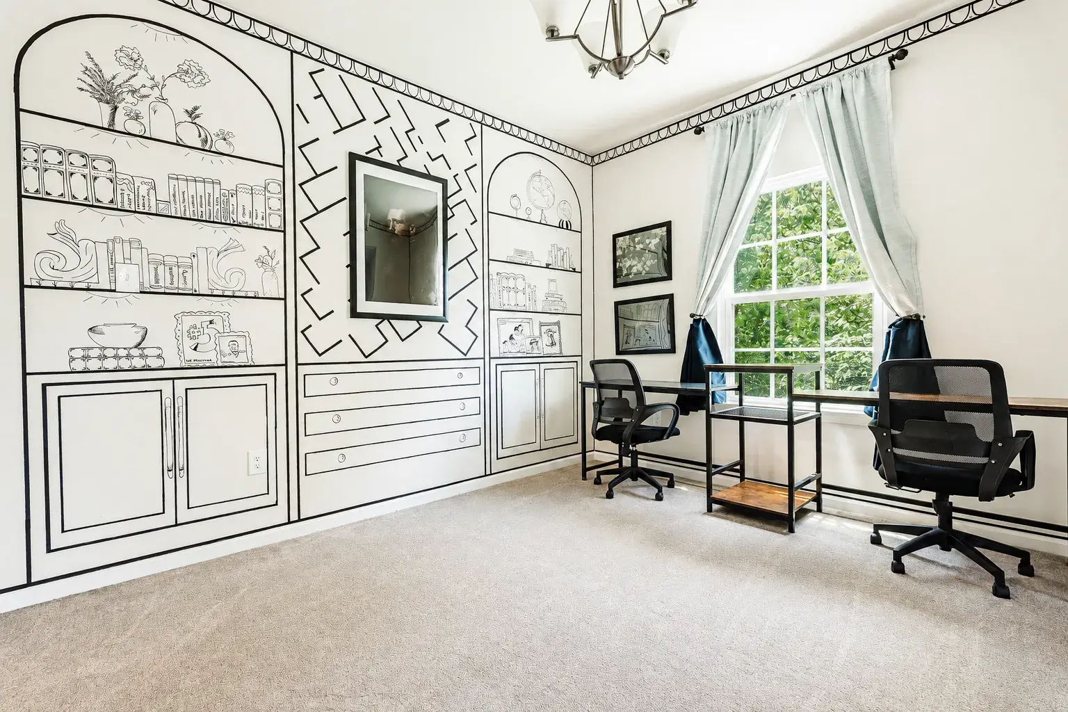 Bright dual-workspace office with large windows and artistic designer walls