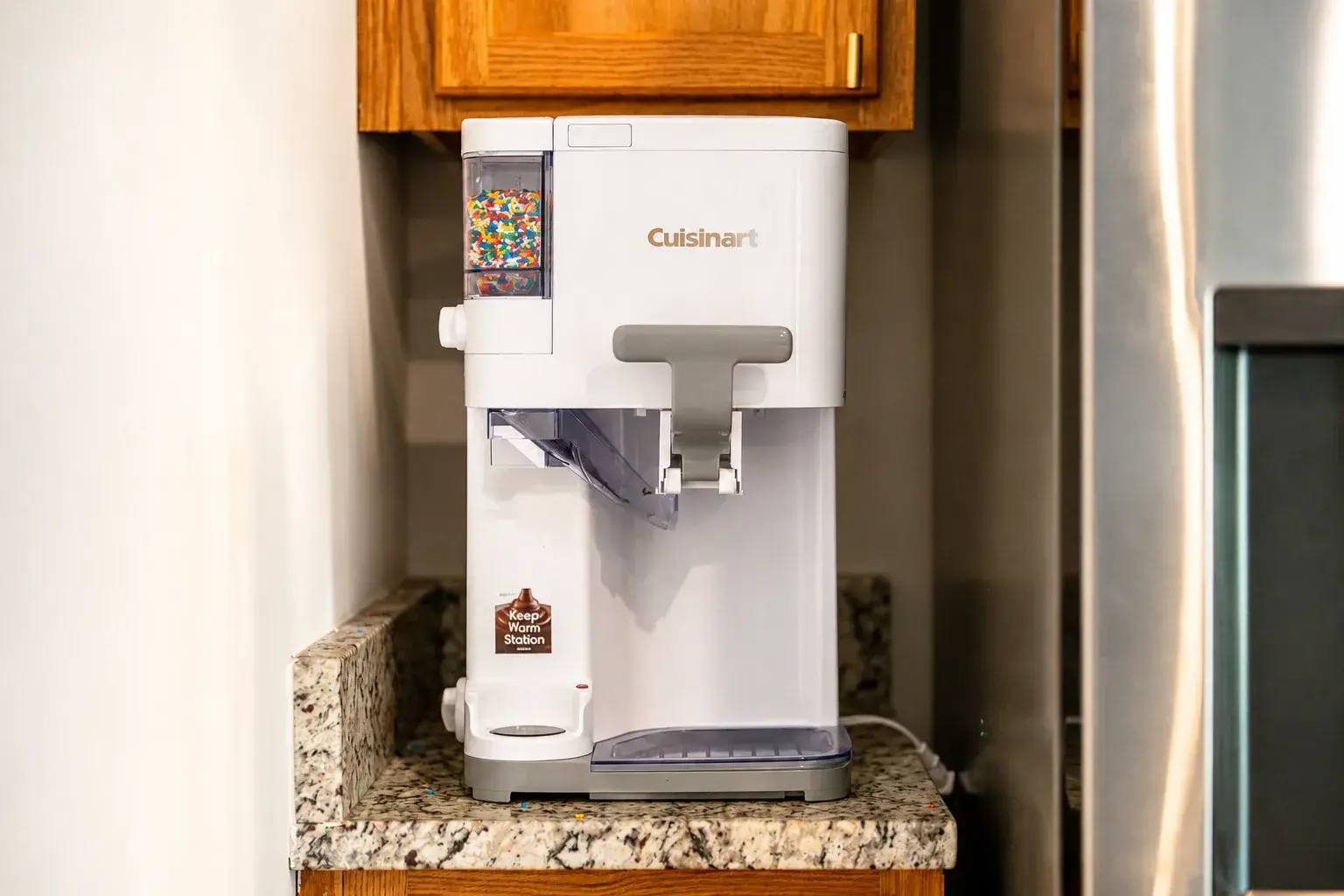 Fun kitchen perk: countertop ice cream maker with toppings station
