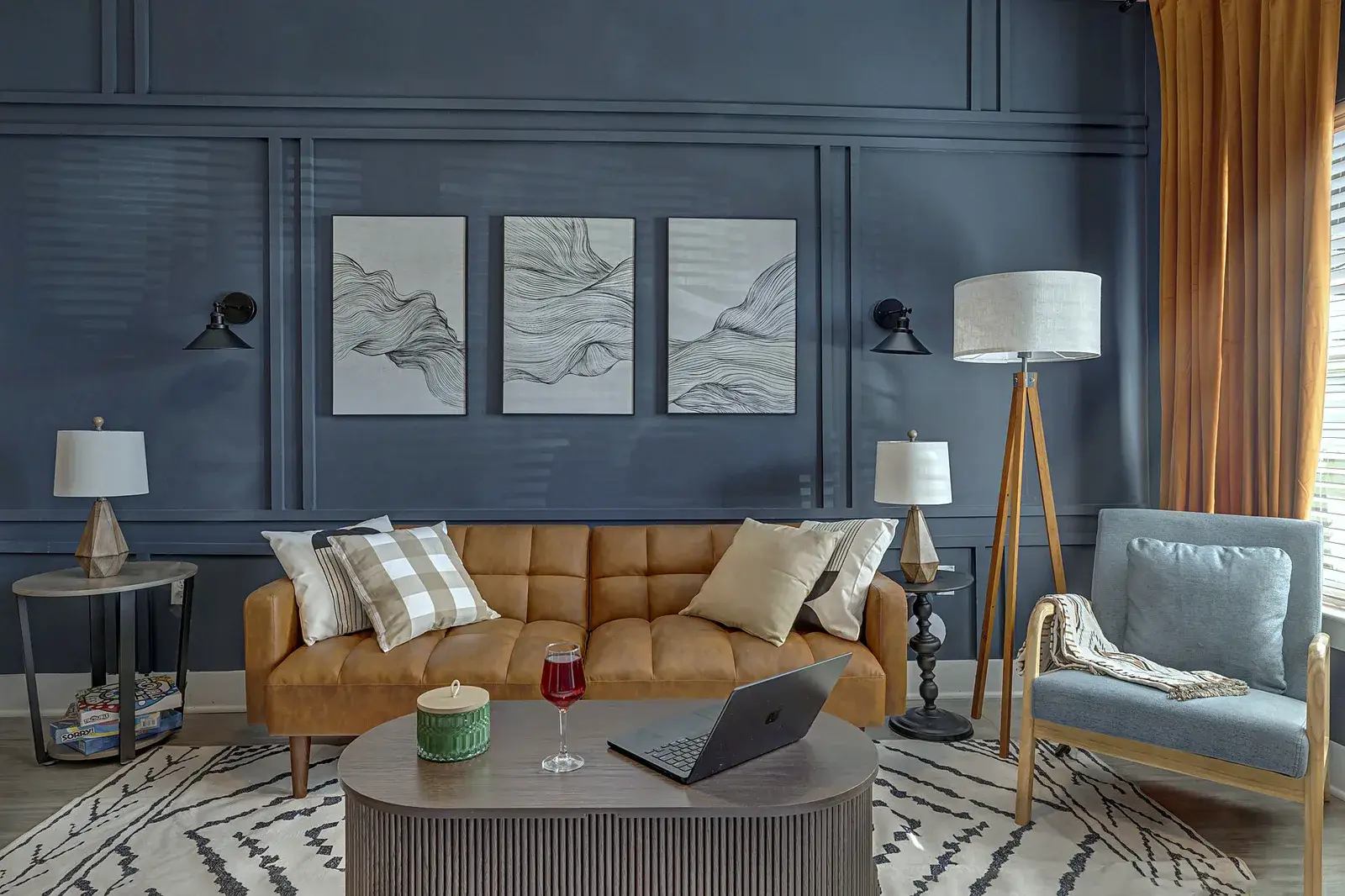 Sophisticated lounge with leather sofa, accent chair, and elegant modern style