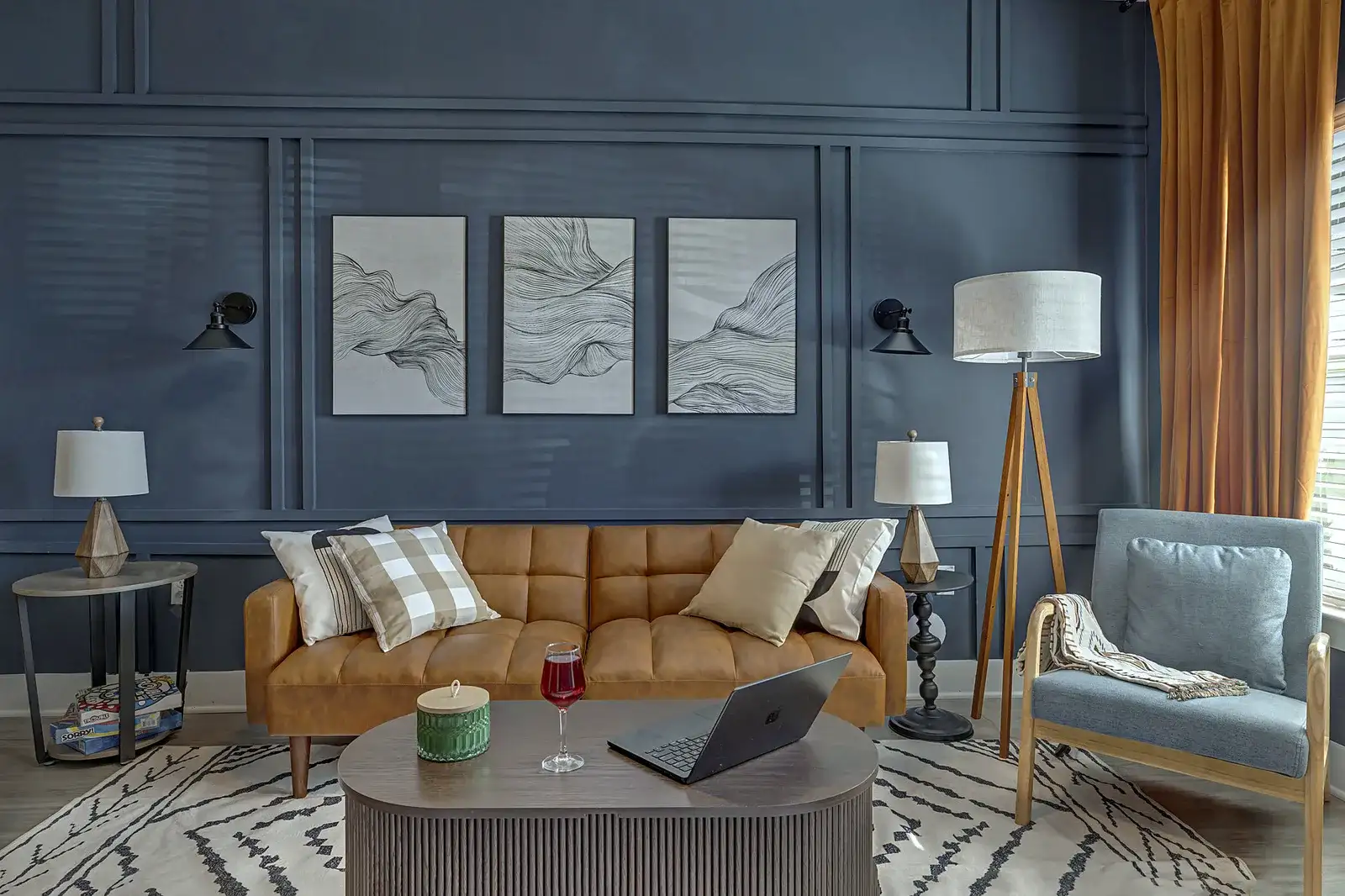 Sophisticated lounge with leather sofa, accent chair, and elegant modern style