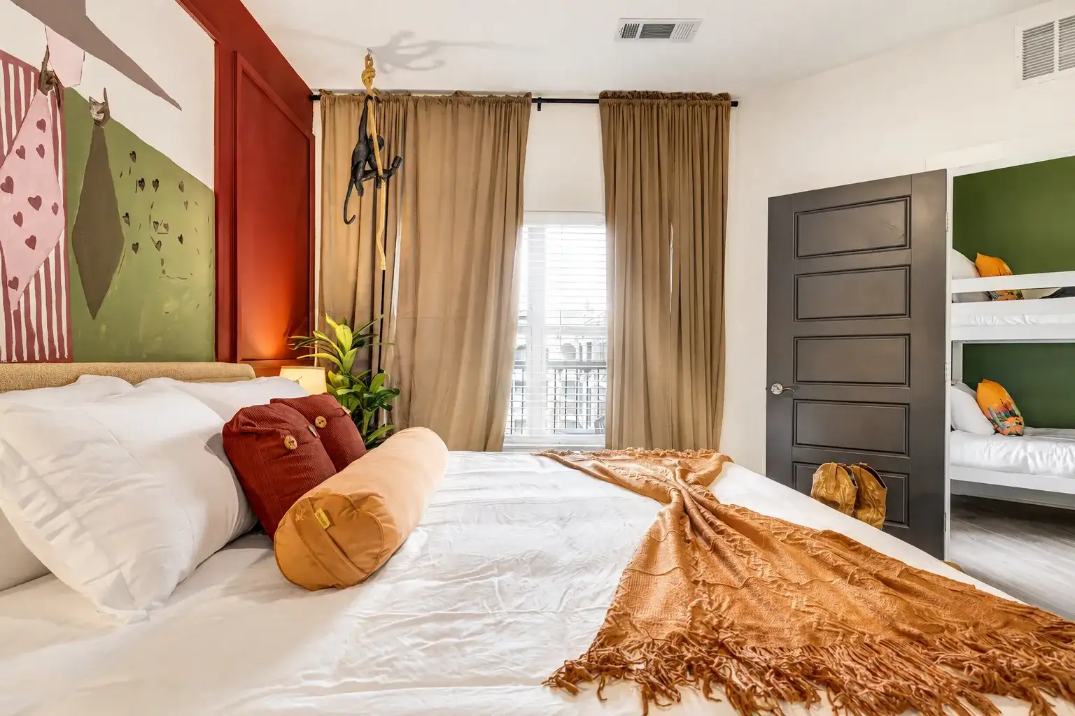 Cozy family-friendly bedroom with king bed and built-in bunk beds
