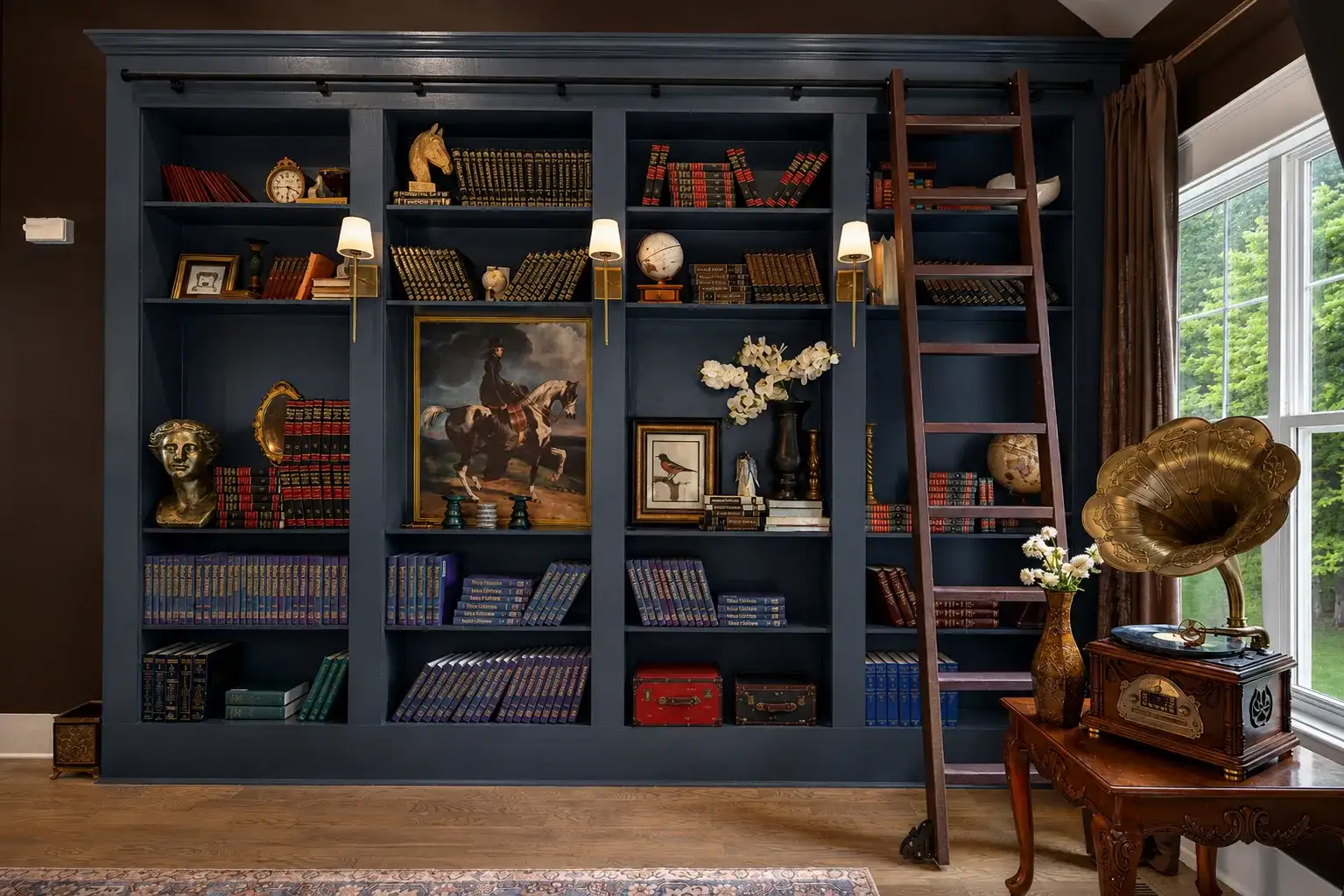 Elegant library wall with rolling ladder and vintage gramophone charm