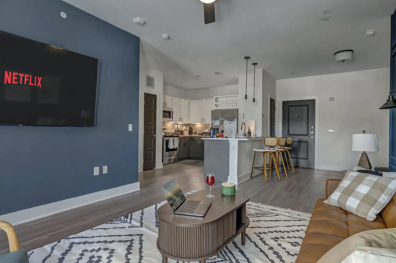 Open living, dining and kitchen in one bright space with a smart TV for movie nights