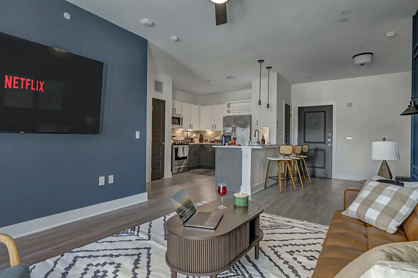 Open living, dining and kitchen in one bright space with a smart TV for movie nights