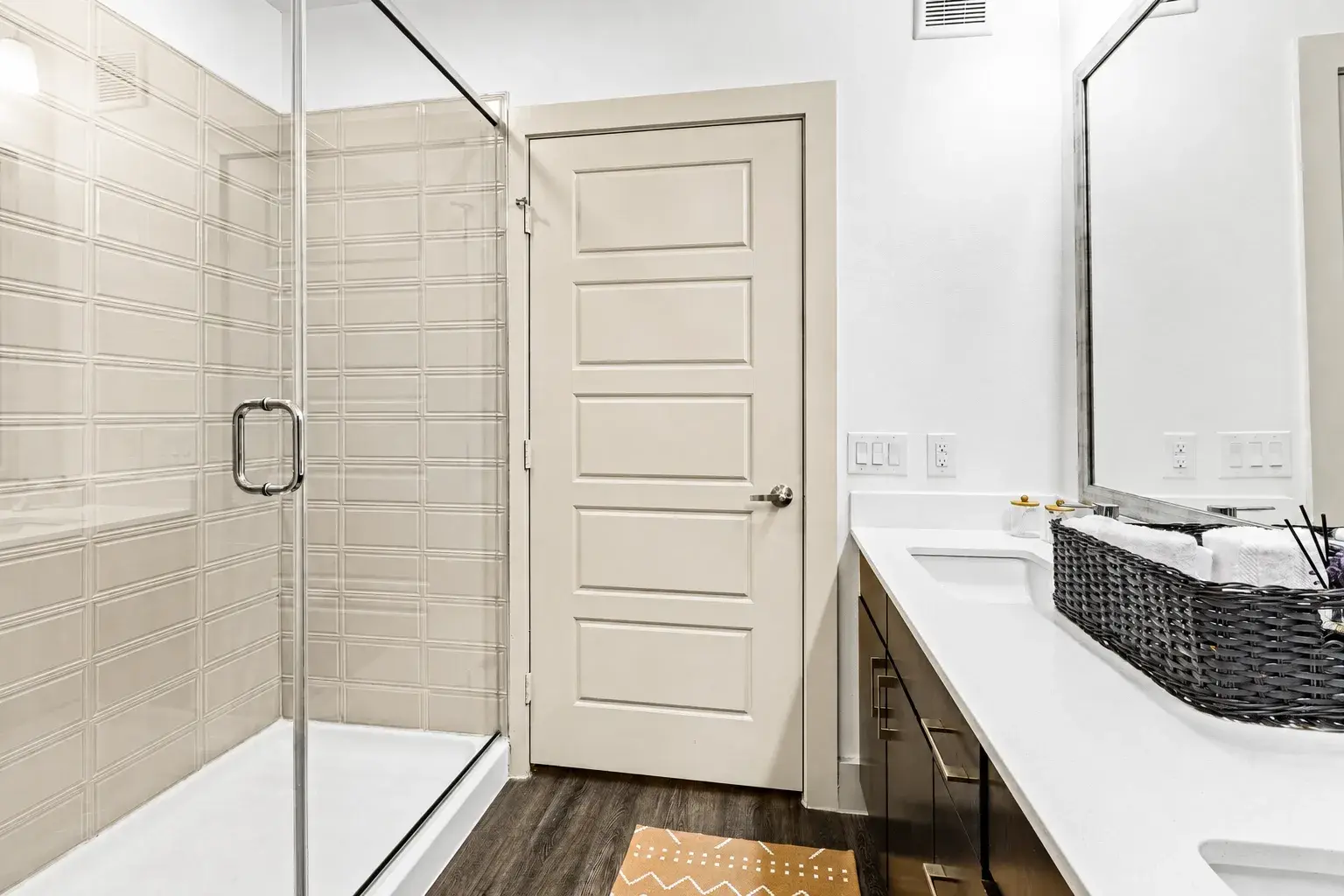 Modern bathroom with glass walk-in shower and spacious double vanity