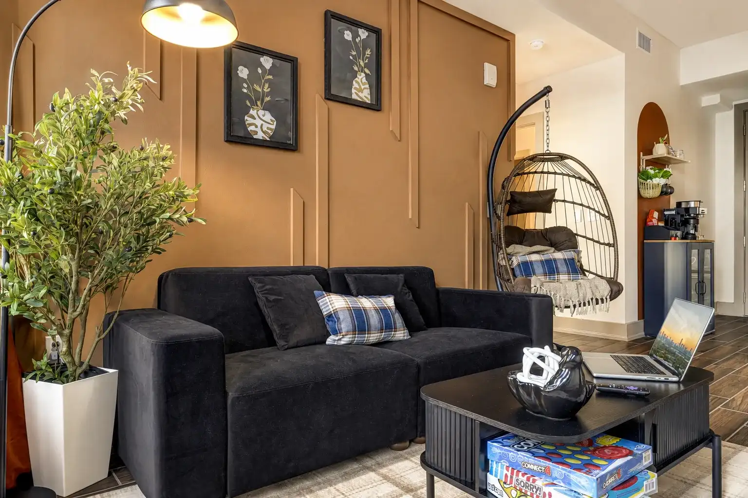 Cozy modern lounge with stylish decor, games, and a relaxing egg chair
