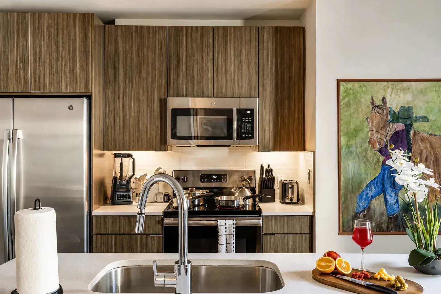 Modern kitchen with stainless appliances and stylish island workspace