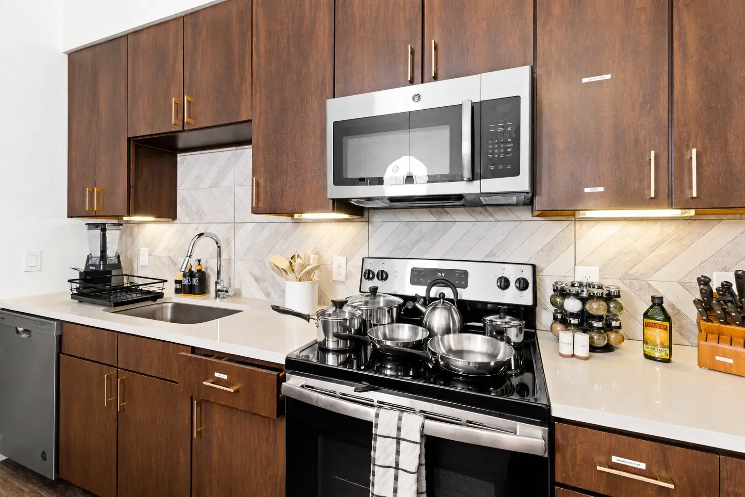 Modern full kitchen with stainless appliances and ample counter space