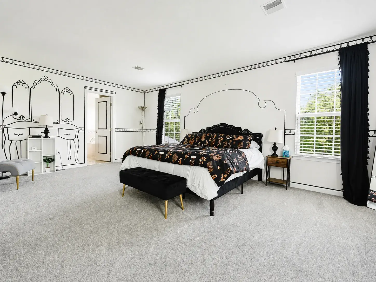 Spacious king suite with bold design, natural light, and boutique charm
