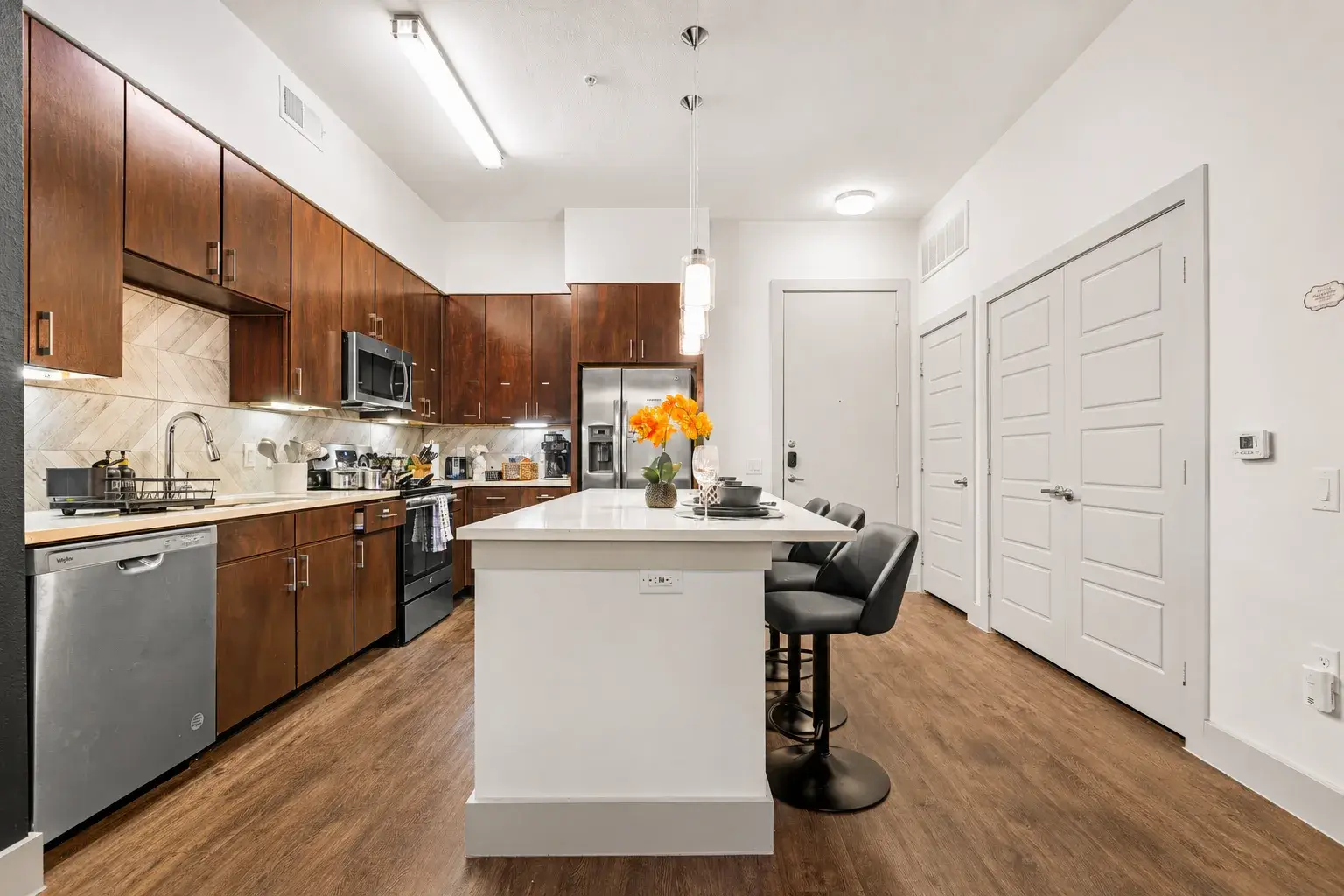 Modern kitchen with island seating and sleek stainless appliances