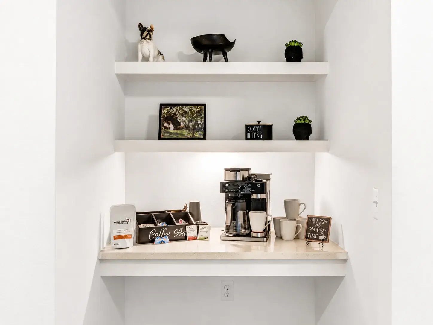 Bright built-in coffee bar with stylish decor and guest-ready essentials