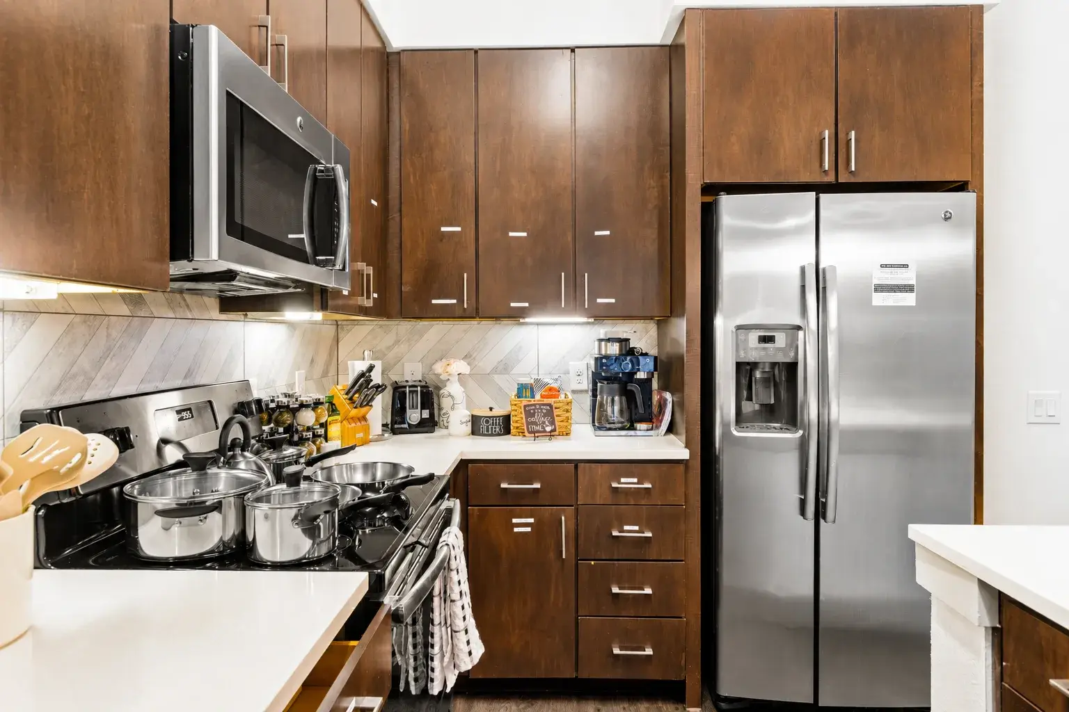 Modern kitchen with stainless appliances and ample cabinet storage