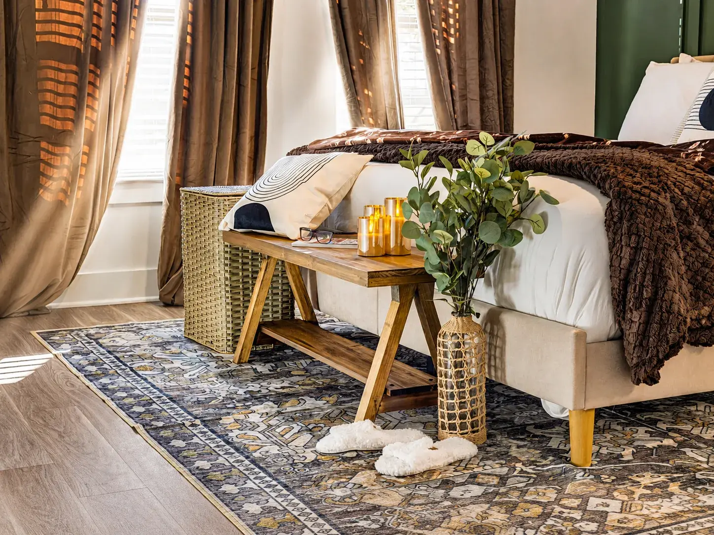 Cozy designer bedroom with warm tones, luxe linens, and elegant decor