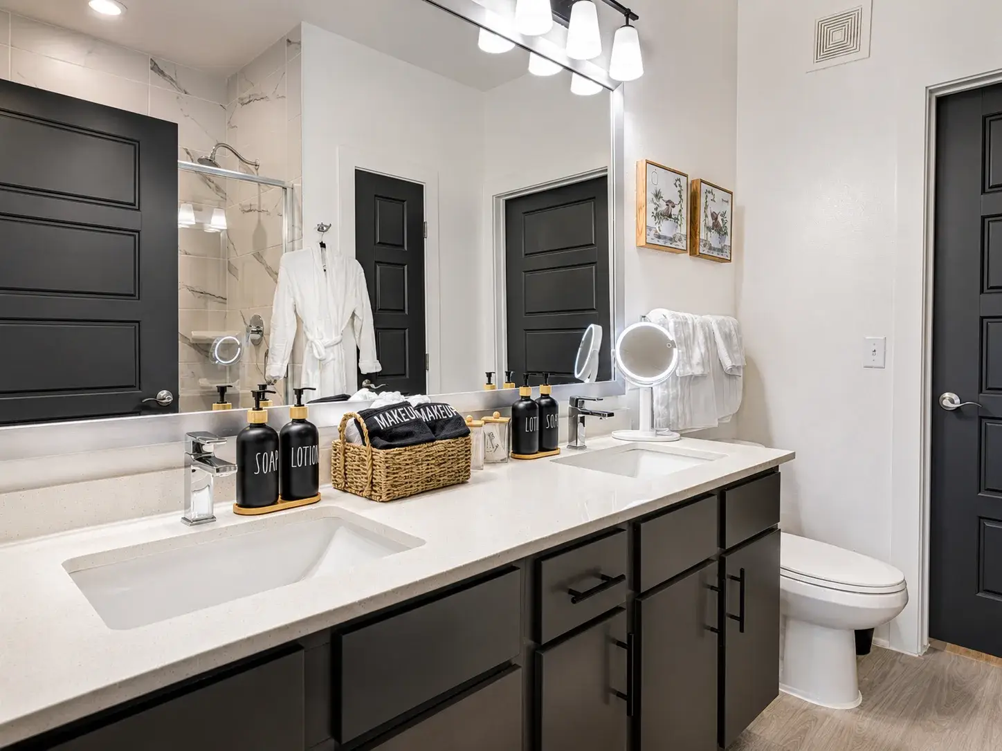 Modern spa-like bathroom with double vanity and sleek designer finishes