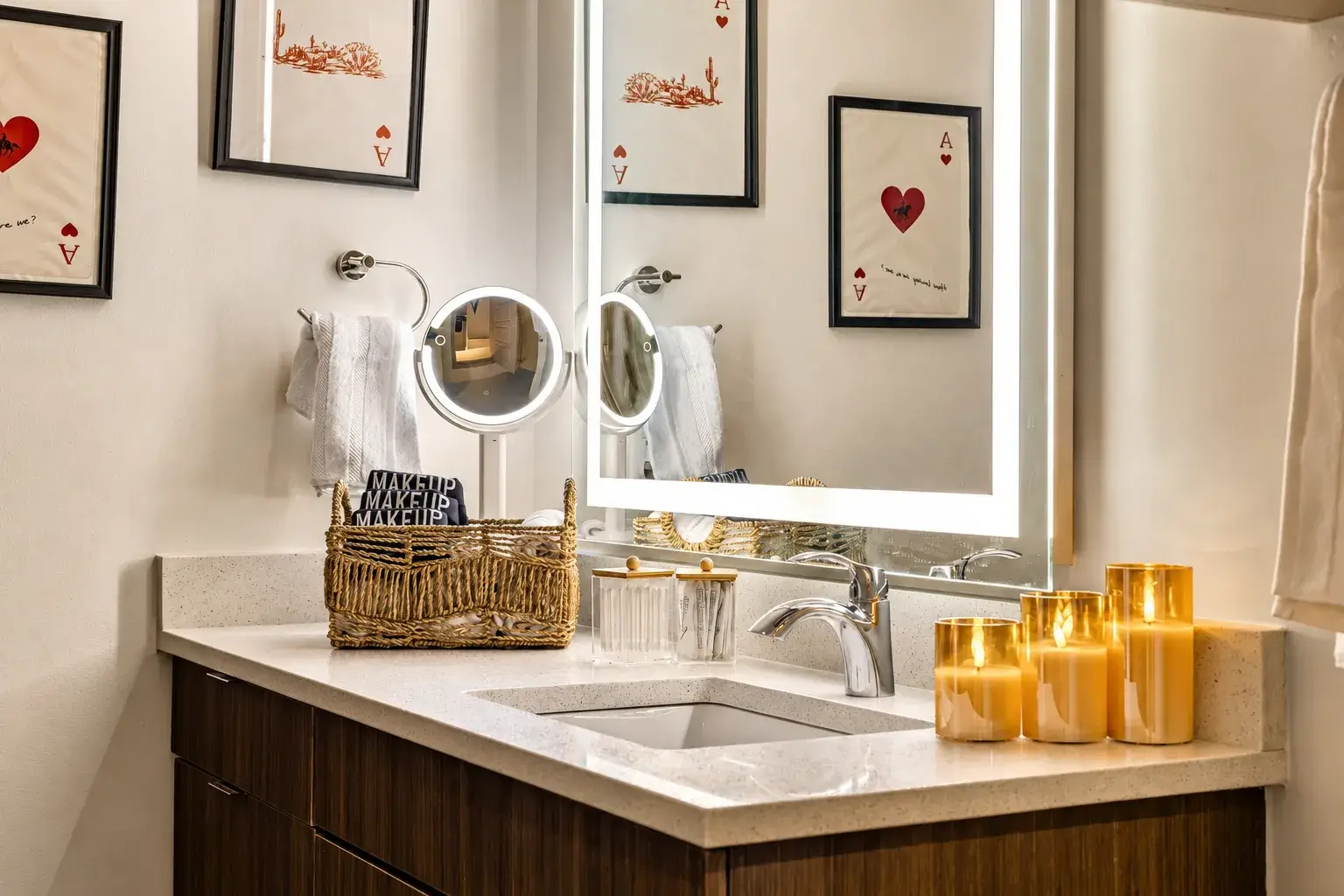 Spa-like bathroom vanity with glowing mirror and thoughtful guest touches