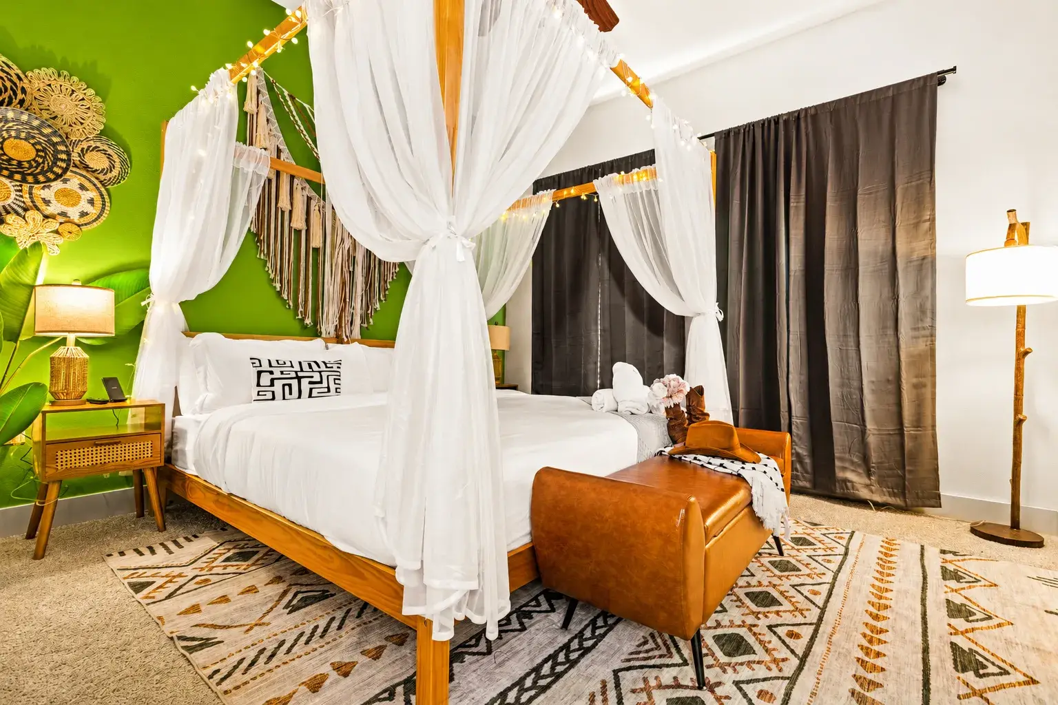 Boho-chic canopy bedroom with bold accents and cozy boutique vibes
