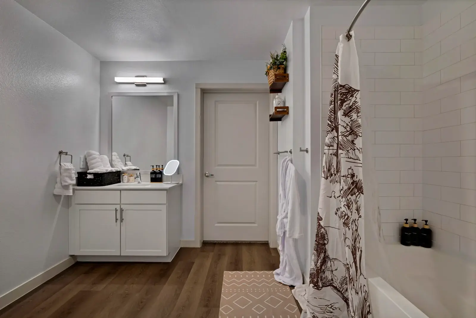Bathroom with a tub and shower