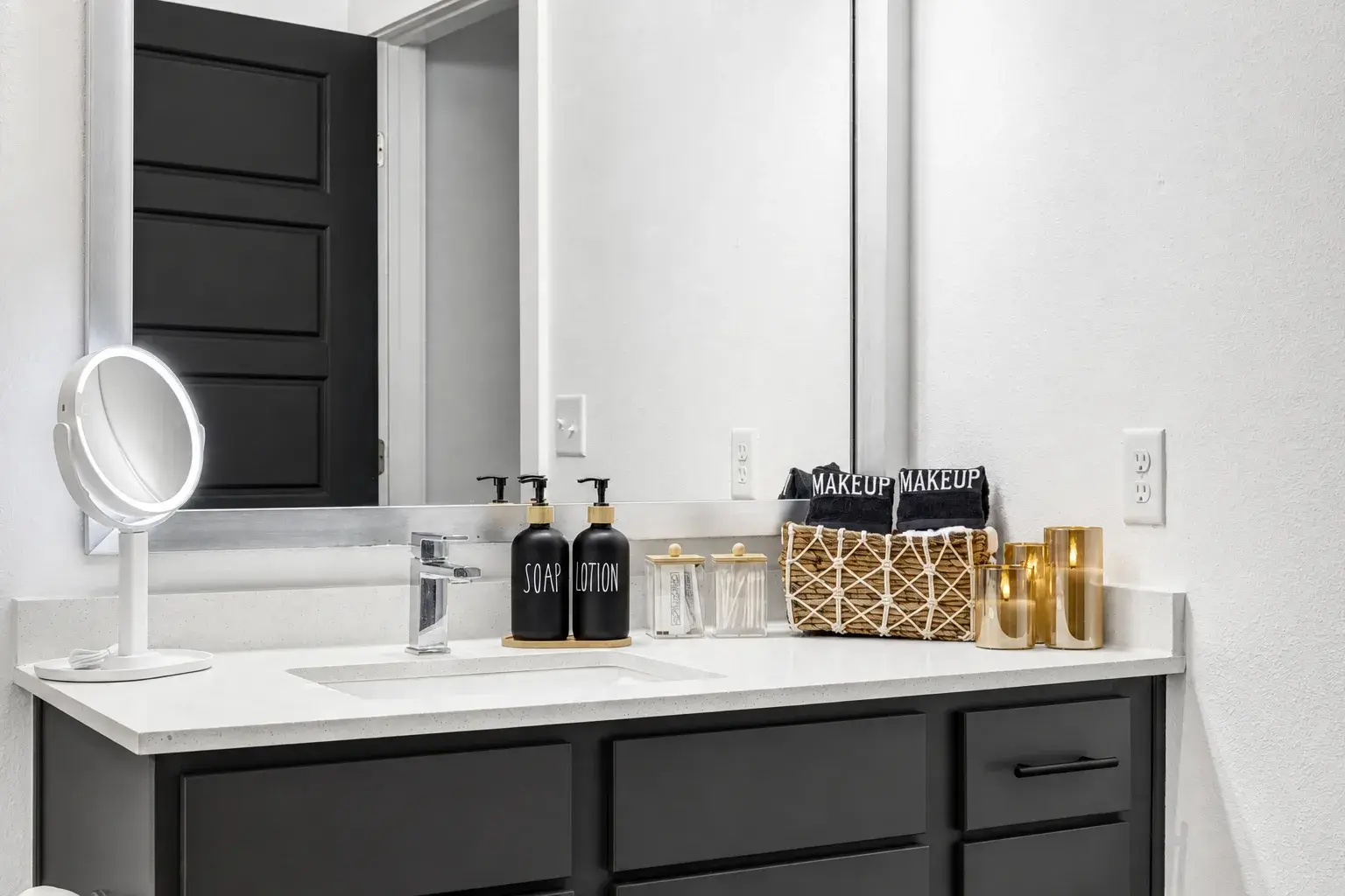 Modern bathroom vanity with upscale guest amenities and sleek finishes