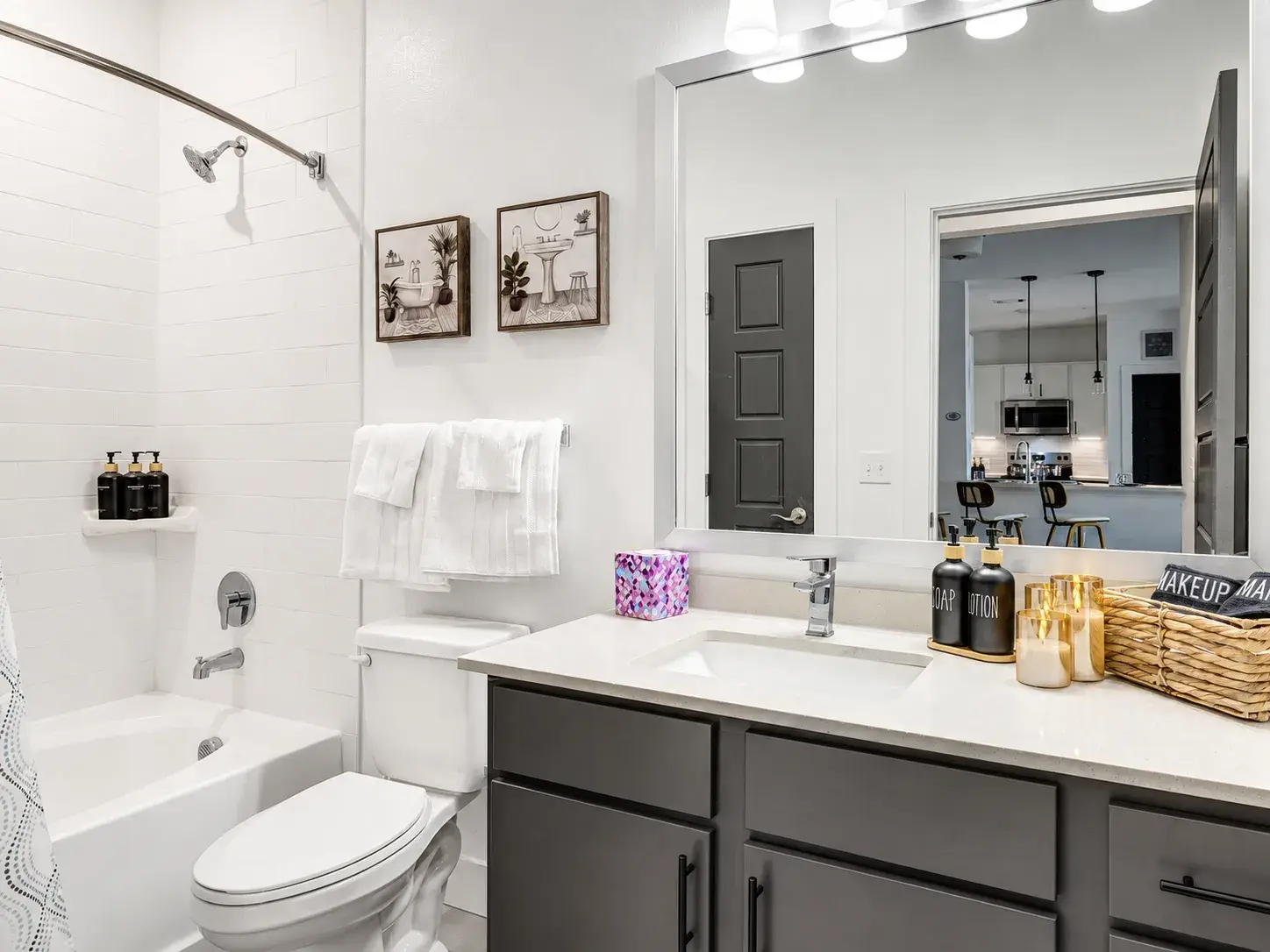 Bright modern bathroom with stylish vanity and tub-shower combo
