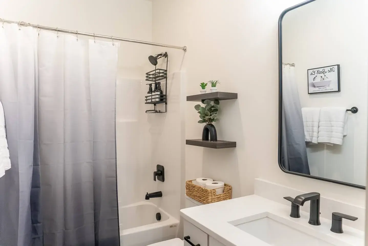 Bright modern bathroom with sleek finishes and tub-shower combo