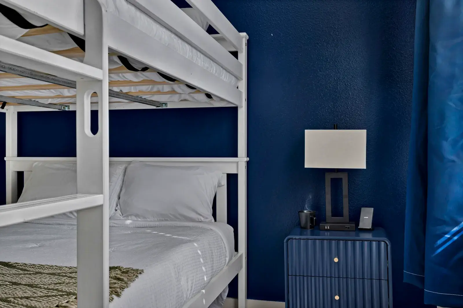 Bunk room with navy walls