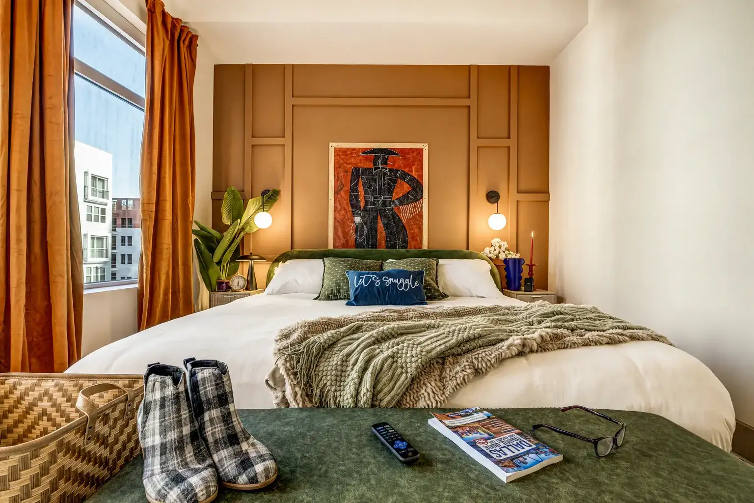 Cozy designer bedroom with king bed, city light, and warm modern style