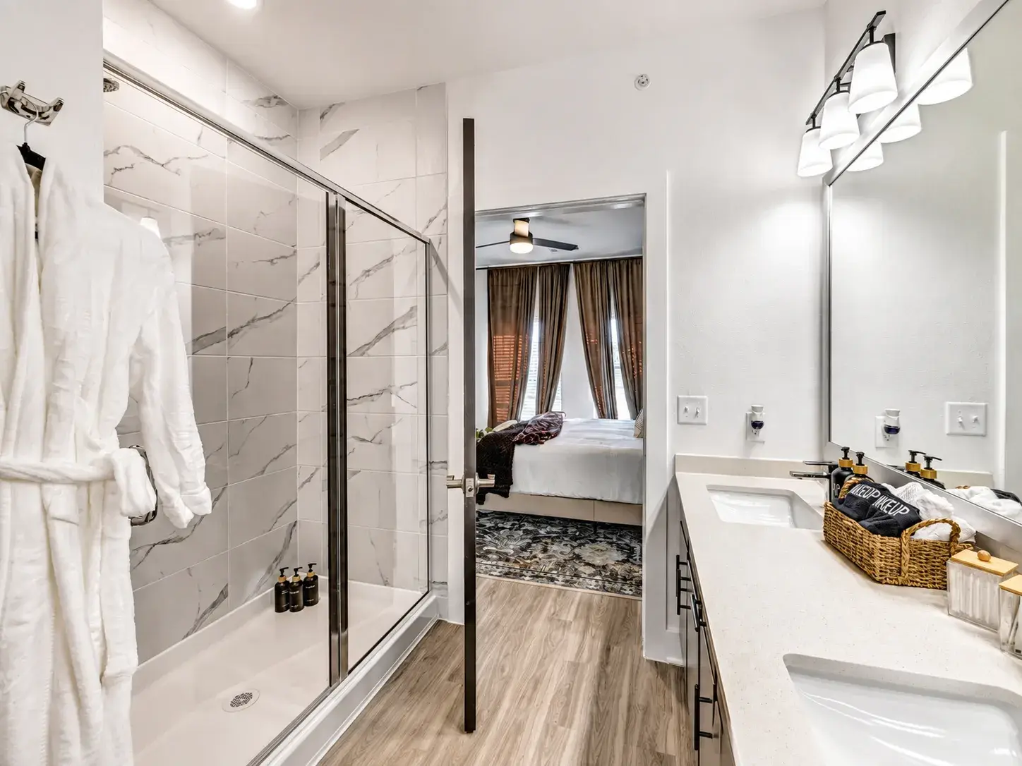 Spa-like bath with dual sinks, walk-in shower, and luxe hotel-style touches